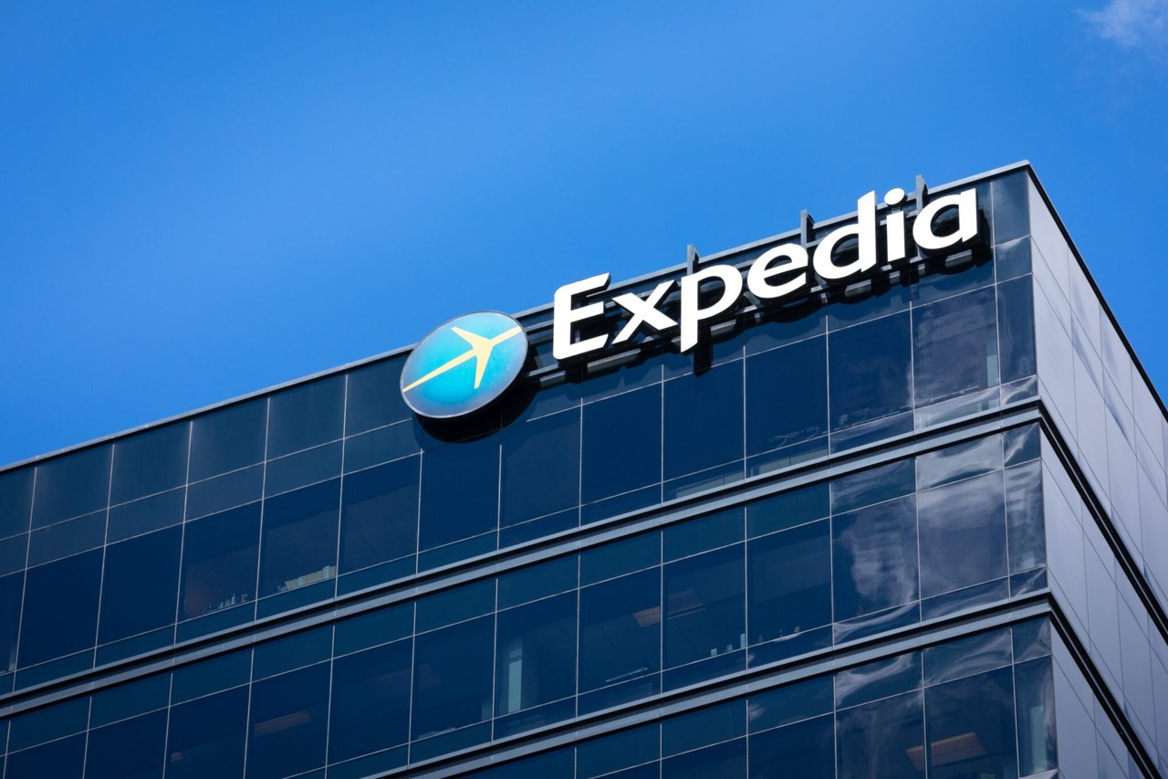 Expedia office building with the Expedia logo against a blue sky