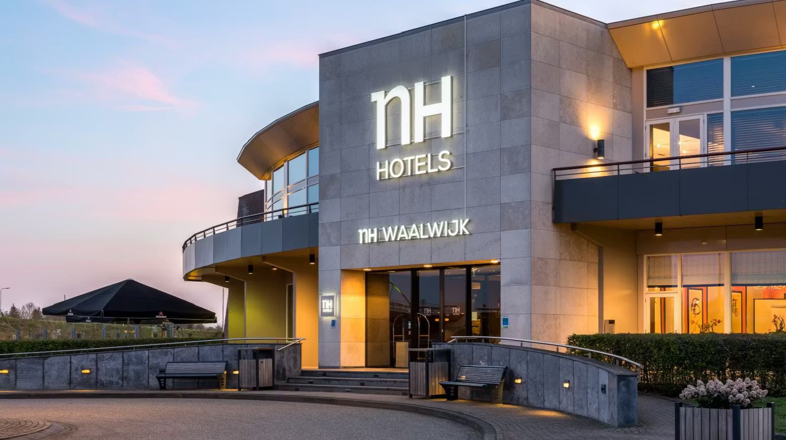 NH Hotels Waalwijk entrance at dusk