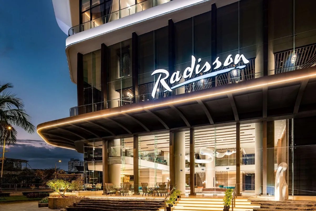 Radisson hotel entrance illuminated at dusk