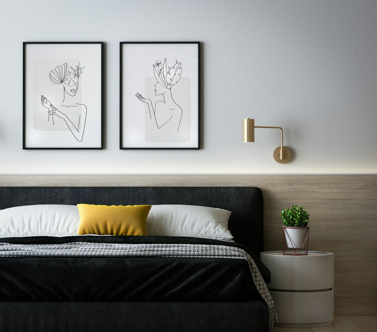 Stylish modern hotel room with a made bed and framed wall art